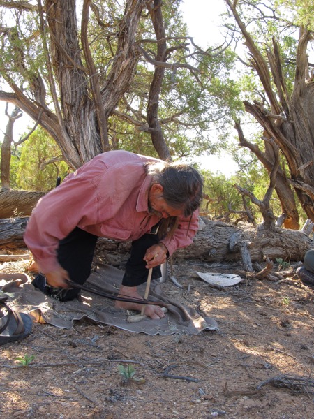 Jeff demonstrating how to start a fire with a bow drill