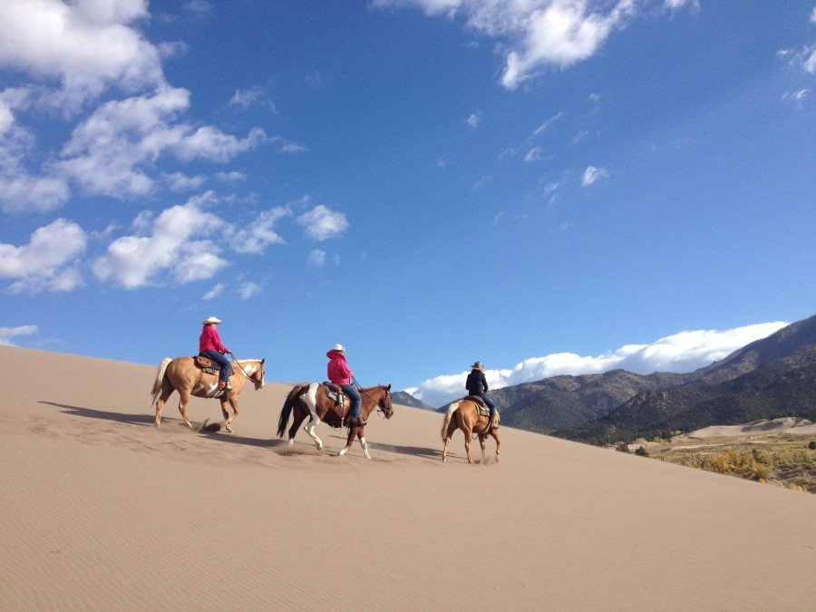 Riding through the sand dunes at Zapata Ranch